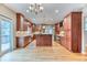 This kitchen has hardwood floors, recessed lighting, and wood cabinets at 16458 W Ellsworth Dr, Golden, CO 80401