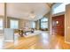 This inviting living room features vaulted ceilings, hardwood floors, and natural light at 16458 W Ellsworth Dr, Golden, CO 80401