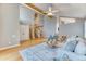 This open living room features hardwood floors, stairs, and plenty of space at 16458 W Ellsworth Dr, Golden, CO 80401
