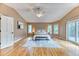 This main bedroom boasts a ceiling fan, a sitting area, and a door to a private balcony at 16458 W Ellsworth Dr, Golden, CO 80401
