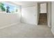 Bedroom featuring a large window, closet and neutral carpet at 14544 March Dr, Denver, CO 80239