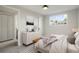 Bright bedroom with carpet, a large window and a view to the exterior at 14544 March Dr, Denver, CO 80239