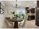 Dining area with backyard access, modern lighting and elegant decor at 14544 March Dr, Denver, CO 80239