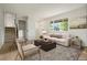 Cozy living room with natural light, neutral furniture, and a modern décor at 14544 March Dr, Denver, CO 80239