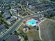 Aerial view showcasing the home's location near the community pool, playground, and walking trails at 14881 Rider Pl, Parker, CO 80134