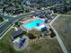 Overhead view of the community pool, playground, and lounge areas, all carefully designed for recreation at 14881 Rider Pl, Parker, CO 80134