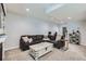 Comfortable living room with neutral walls and large sofa providing ample seating, complete with a coffee table at 14881 Rider Pl, Parker, CO 80134