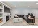 Cozy living room with fireplace, built-in shelving, and a comfortable couch for relaxing and entertaining at 14881 Rider Pl, Parker, CO 80134