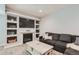 Cozy living room with fireplace, built-in shelving, and a comfortable couch perfect for relaxing at 14881 Rider Pl, Parker, CO 80134