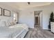 Spacious main bedroom showcases plush carpeting and a glimpse into the ensuite bathroom at 14881 Rider Pl, Parker, CO 80134