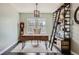 Home office features a wooden desk, ladder shelf, wooden floors, and ample natural light for a productive workspace at 14881 Rider Pl, Parker, CO 80134