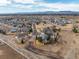 Expansive aerial view showcasing the neighborhood with mountain views at 4495 Rainbow Ln, Broomfield, CO 80020