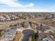 Wide aerial view of a residential neighborhood and surrounding landscape at 4495 Rainbow Ln, Broomfield, CO 80020