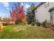 A spacious backyard, with mature trees, awaits the next Gathering at 4495 Rainbow Ln, Broomfield, CO 80020