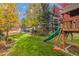 Enjoy Gathering fun in this backyard with play structure at 4495 Rainbow Ln, Broomfield, CO 80020