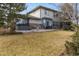 Spacious backyard with a hot tub, patio, and outdoor seating area at 4495 Rainbow Ln, Broomfield, CO 80020