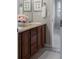 Bathroom featuring a single sink vanity with dark cabinets and a walk-in shower at 4495 Rainbow Ln, Broomfield, CO 80020