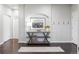 Stylish foyer with hardwood floors, neutral paint, decorative console table, and elegant wall decor at 4495 Rainbow Ln, Broomfield, CO 80020