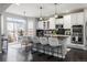 Bright kitchen with stainless steel appliances and kitchen island seating at 4495 Rainbow Ln, Broomfield, CO 80020