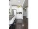 Kitchen view with stainless steel appliances and dark wood flooring at 4495 Rainbow Ln, Broomfield, CO 80020