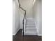 Carpeted staircase with dark wood handrail at 4495 Rainbow Ln, Broomfield, CO 80020