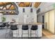 Modern bar area with pendant lighting, seating and countertops at 6940 E Girard Ave # 210, Denver, CO 80224