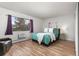 Bright bedroom with a cozy bed, stylish decor, and a large window that provides plenty of natural light at 6940 E Girard Ave # 210, Denver, CO 80224