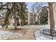 Attractive apartment building with snow and landscaping, showing its curb appeal and surrounding environment at 6940 E Girard Ave # 210, Denver, CO 80224
