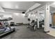 Brightly lit gym equipped with treadmills, weights, and mirrored walls at 6940 E Girard Ave # 210, Denver, CO 80224