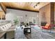 Comfortable lobby featuring a brick fireplace, wooden ceiling and elegant seating area at 6940 E Girard Ave # 210, Denver, CO 80224