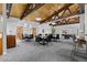 Large recreation room with tables, chairs and a billiard area under a wooden ceiling at 6940 E Girard Ave # 210, Denver, CO 80224