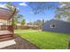 Lush backyard with a deck and a grassy area, perfect for relaxation and entertainment at 1238 Rosemary St, Denver, CO 80220
