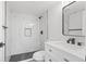 Modern bathroom featuring an oversized shower with beautiful marble tiling and black fixtures at 1238 Rosemary St, Denver, CO 80220