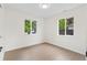 Inviting bedroom with bright walls, laminate flooring, and abundant natural light, ideal for restful sleep at 1238 Rosemary St, Denver, CO 80220