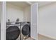 Convenient laundry area with modern Samsung washer and dryer units, and folding door at 1238 Rosemary St, Denver, CO 80220