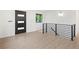 Spacious living room featuring modern flooring, large windows and a sleek staircase at 1238 Rosemary St, Denver, CO 80220