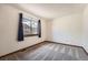 Empty bedroom with a large window bringing in natural light at 1408 W Briarwood Ave, Littleton, CO 80120