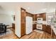 Bright and airy kitchen with modern appliances, generous counter space, and a sliding door to the outside deck at 1408 W Briarwood Ave, Littleton, CO 80120