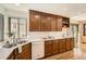 Well-lit kitchen featuring ample counter space, hardwood floors, and lots of cabinet storage at 1408 W Briarwood Ave, Littleton, CO 80120