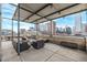 Spacious rooftop deck with city views, seating, and covered areas at 1499 Blake St # 1F, Denver, CO 80202