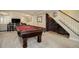 Finished basement with a pool table, wine storage and access to the upper floor at 10914 W Coco Pl, Littleton, CO 80127