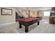 Finished basement featuring a pool table and wine rack at 10914 W Coco Pl, Littleton, CO 80127