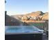 Hot tub with a scenic mountain view, perfect for relaxing and enjoying the landscape at 10914 W Coco Pl, Littleton, CO 80127