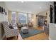 Bright living room with hardwood floors, recessed lighting, and comfortable seating perfect for entertaining at 10914 W Coco Pl, Littleton, CO 80127