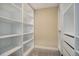 Well-organized walk-in closet with ample shelving space for optimal storage and organization at 10914 W Coco Pl, Littleton, CO 80127