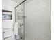 Contemporary bathroom with a glass-enclosed shower and white subway tile at 700 N Washington St # 1104, Denver, CO 80203