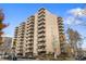 Tall apartment building featuring multi-story facade, private balconies, and street view at 700 N Washington St # 1104, Denver, CO 80203