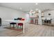Open common area with dining table, bar seating, and access to kitchen at 700 N Washington St # 1104, Denver, CO 80203