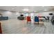 Large common area featuring multiple seating arrangements, dining tables, and ample space at 700 N Washington St # 1104, Denver, CO 80203