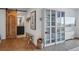 Entryway featuring hardwood floors, sliding barn door leading to the bathroom and storage unit at 700 N Washington St # 1104, Denver, CO 80203